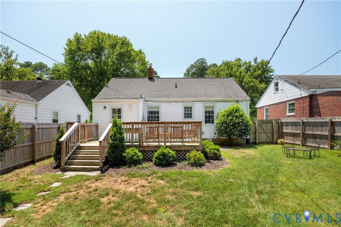 6710 Hanover Avenue, Westhampton Heights, Richmond, VA 23226 Charming cottage-style home with a welcoming wooden deck and steps, complemented by mature landscaping and shrub plantings