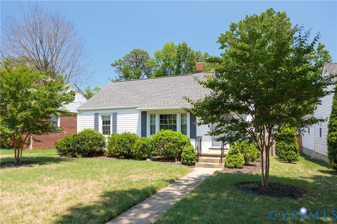 6710 Hanover Avenue, Westhampton Heights, Richmond, VA 23226 White siding exterior with a shingle roof, established landscaping, concrete pathway, and a front entry with handrails