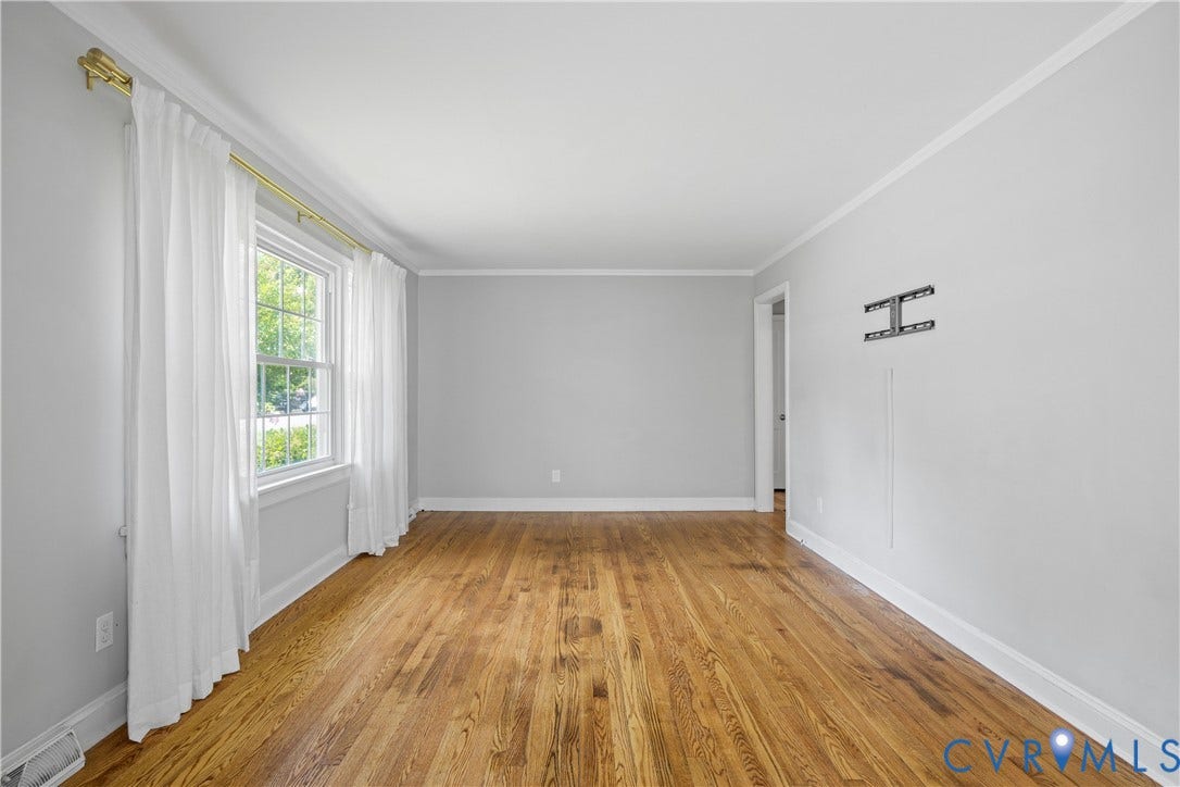 6710 Hanover Avenue, Westhampton Heights, Richmond, VA 23226 Hardwood flooring, crown molding, white trim, recessed window, and light gray wall paint