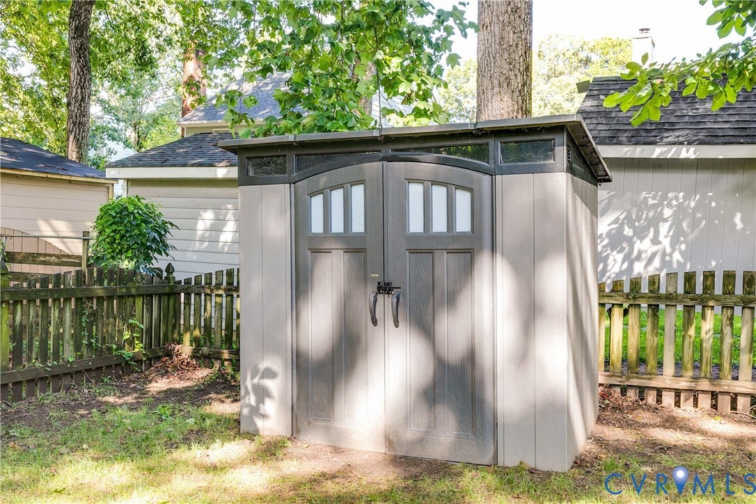 2844 Broadford Lane, Henrico, VA 23233 Freestanding storage shed featuring dual doors, transom windows, and a sloped roof
