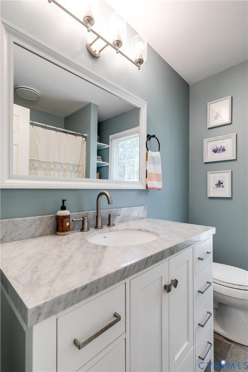 2844 Broadford Lane, Henrico, VA 23233 White shaker vanity with a stone countertop, undermount sink, and three-piece faucet