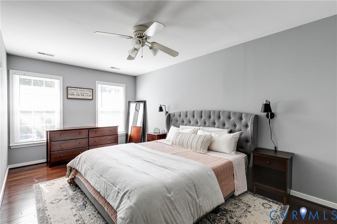 2844 Broadford Lane, Henrico, VA 23233 Hardwood flooring, two windows, ceiling fan, neutral wall color, and a tufted headboard