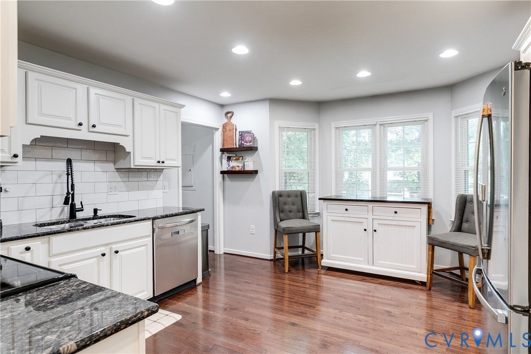 2844 Broadford Lane, Henrico, VA 23233 White cabinetry, black countertops, stainless steel appliances, wood-finish flooring, and recessed lighting