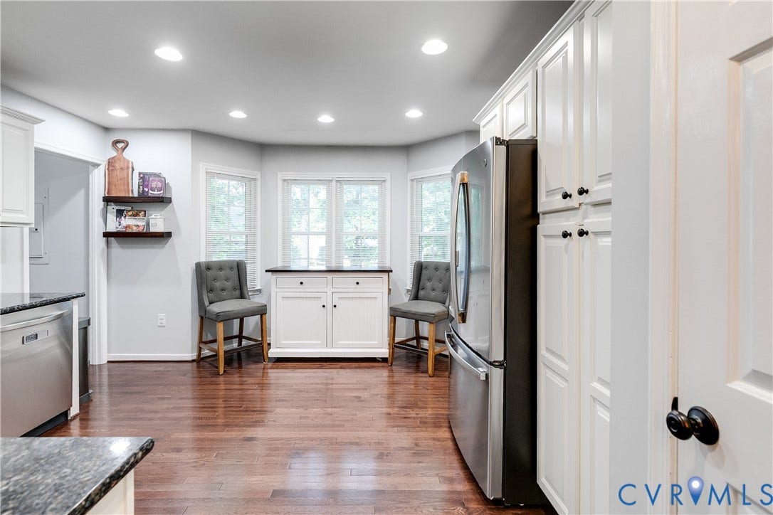 2844 Broadford Lane, Henrico, VA 23233 Hardwood flooring, stainless steel refrigerator, white cabinetry, recessed lighting, and a built-in bay window cabinet