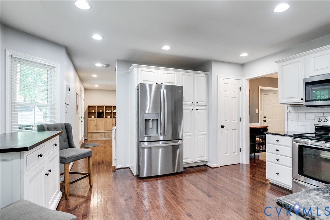 2844 Broadford Lane, Henrico, VA 23233 Kitchen featuring stainless steel appliances, white cabinetry, dark stone countertops, wood-finish flooring, and recessed lighting
