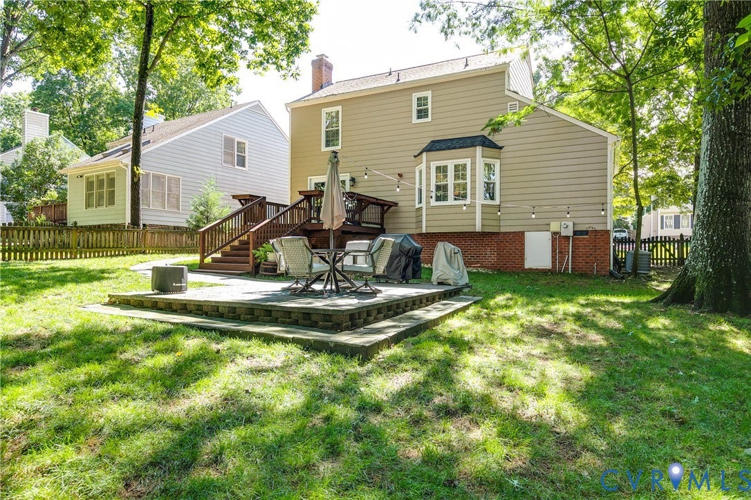 2844 Broadford Lane, Henrico, VA 23233 Expansive rear yard with a tiered patio, wood deck, and bay window