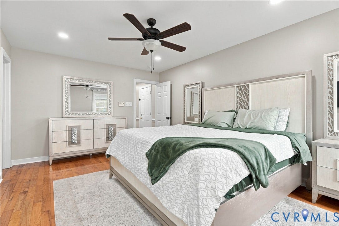 Master Bedroom Recessed lighting, wood-finish flooring, ceiling fan with light fixture, and light gray wall paint
