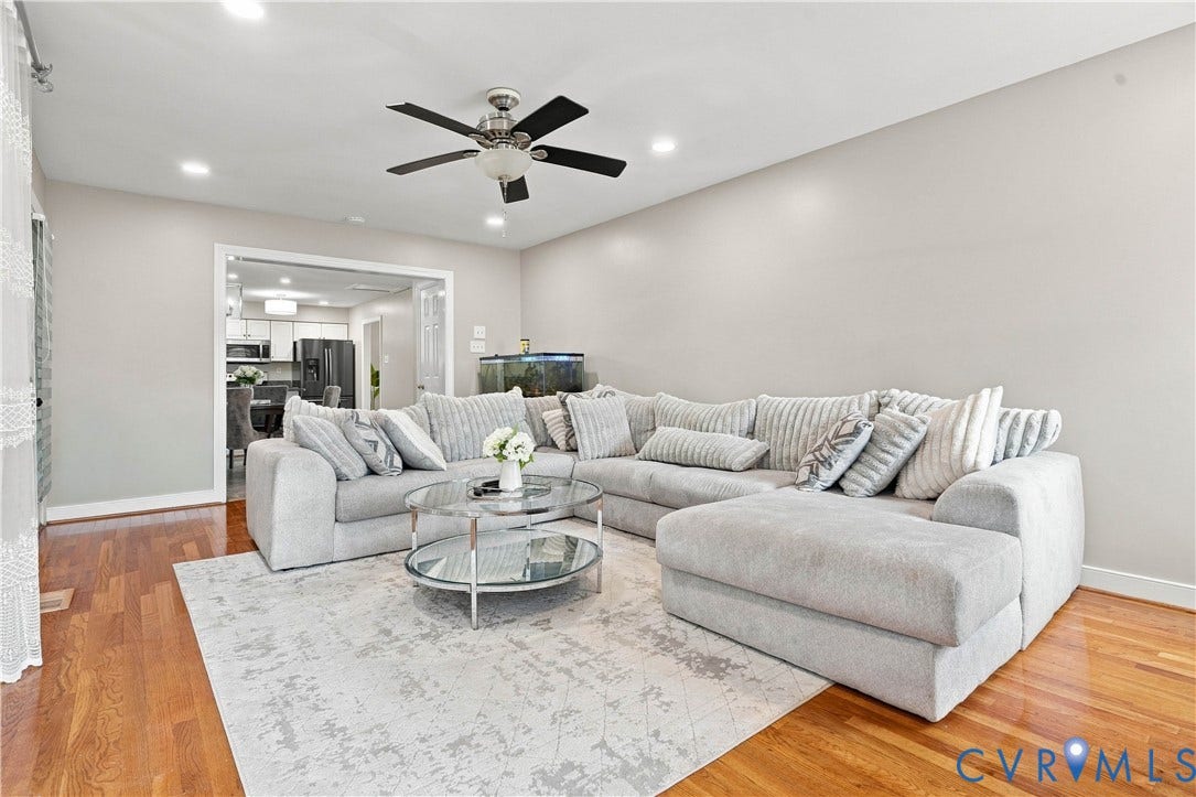Hardwood flooring, recessed lighting, and a ceiling fan with integrated lighting