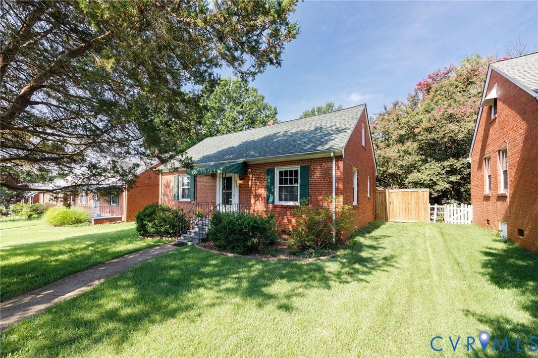 808 W 47th Street, Richmond, VA 23225 Brick exterior residence with shingled roof and coordinating window shutters