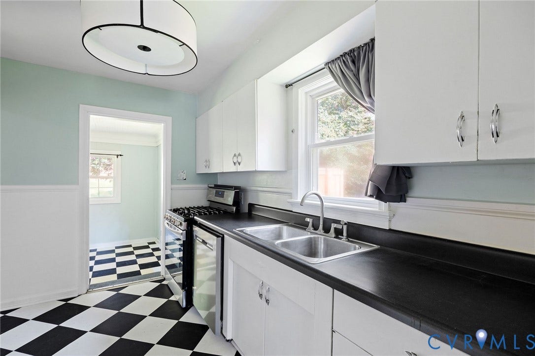 808 W 47th Street, Richmond, VA 23225 Kitchen featuring black and white checkerboard flooring, white cabinetry with chrome hardware, a double-basin stainless steel sink, a stainless steel range, and a drum-style ceiling light