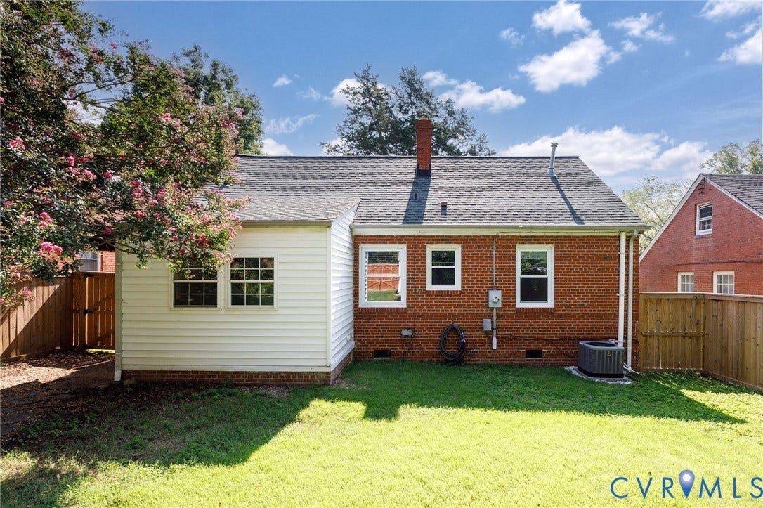 808 W 47th Street, Richmond, VA 23225 Expansive grassy yard with a combination brick and siding exterior