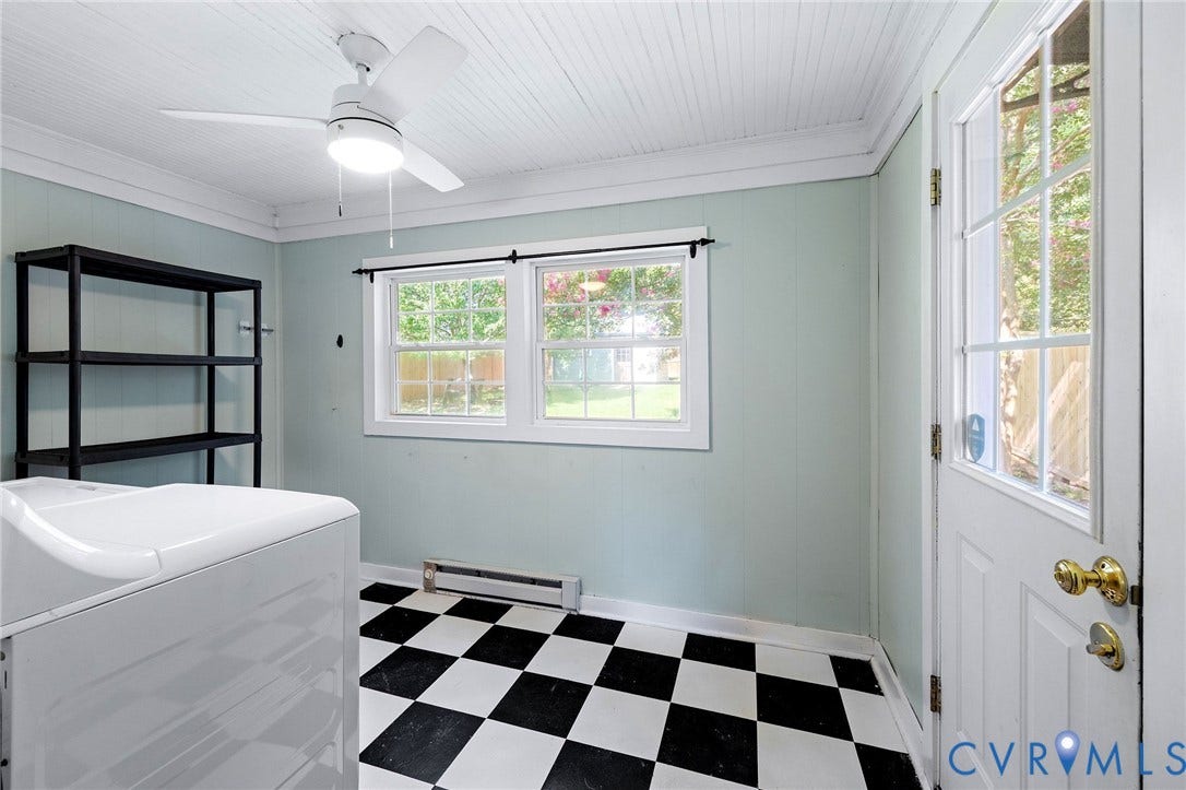 808 W 47th Street, Richmond, VA 23225 Black and white checkered flooring, two windows, ceiling fan, beaded panel ceiling, and a glass-paneled exterior door