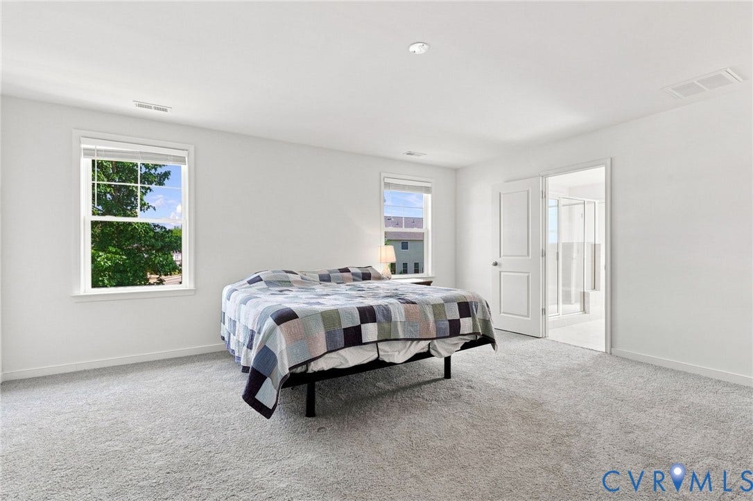 6400 Richwood Trail, Aston Oaks (Section 1), Chesterfield, VA 23120 Spacious room with light gray carpeting, two large windows, a recessed ceiling light, and an adjoining bathroom featuring a glass-enclosed shower