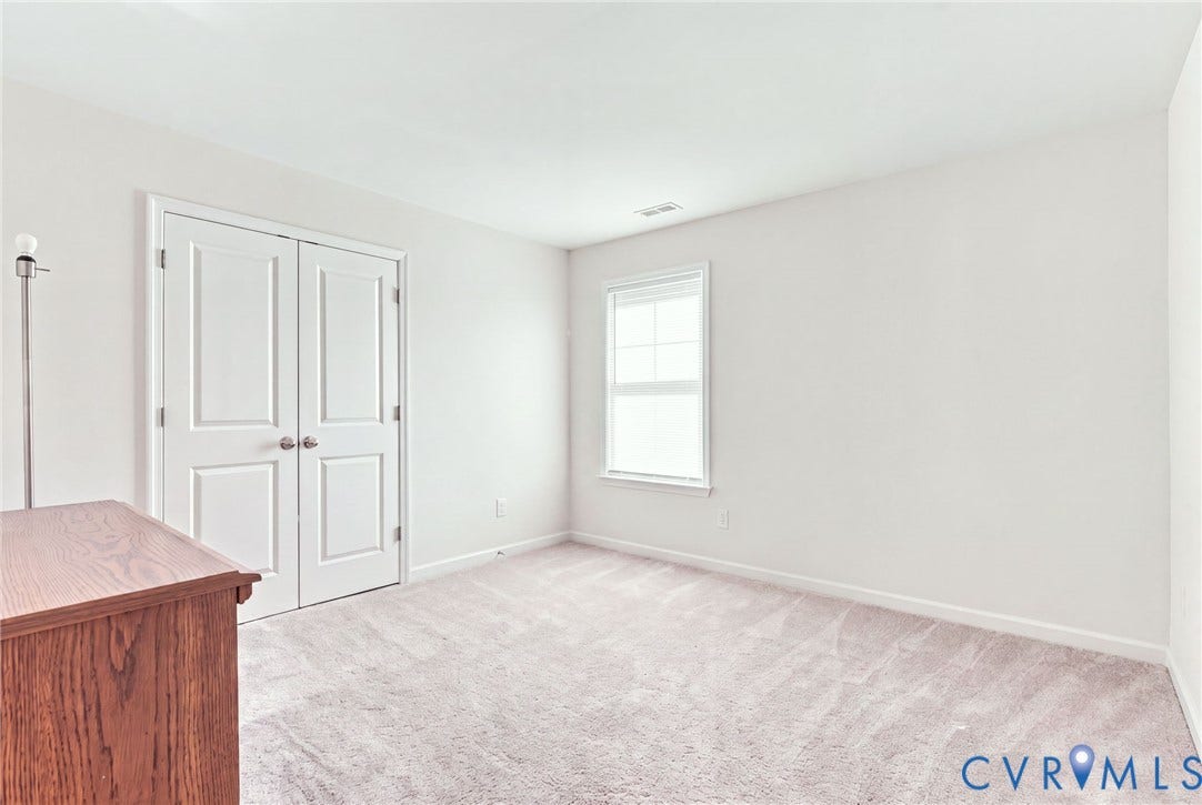 6400 Richwood Trail, Aston Oaks (Section 1), Chesterfield, VA 23120 Neutral wall color, light-toned carpet, and a window with white trim