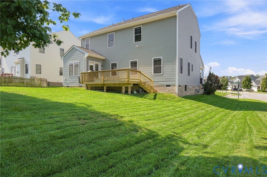 6400 Richwood Trail, Aston Oaks (Section 1), Chesterfield, VA 23120 Expansive green lawn with a multi-level wood-finish deck and attached sunroom