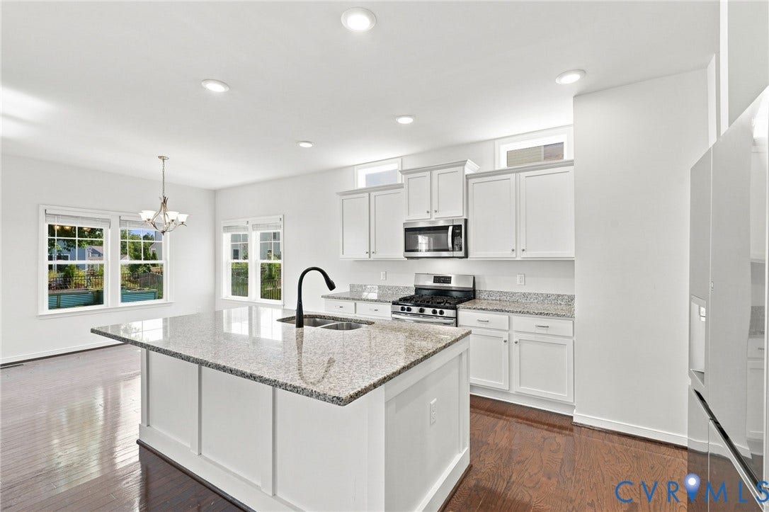 6400 Richwood Trail, Aston Oaks (Section 1), Chesterfield, VA 23120 Kitchen with a central island featuring a double-basin sink and a gooseneck faucet