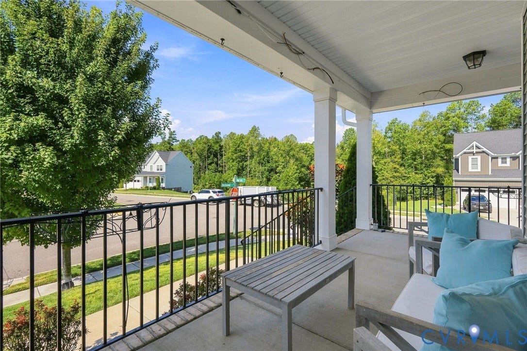 6400 Richwood Trail, Aston Oaks (Section 1), Chesterfield, VA 23120 Expansive covered deck with black metal railing overlooking manicured lawn and mature landscaping