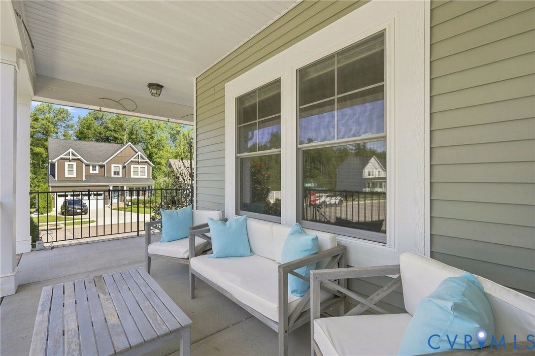 6400 Richwood Trail, Aston Oaks (Section 1), Chesterfield, VA 23120 Covered front porch with white columns, concrete flooring, and light green siding