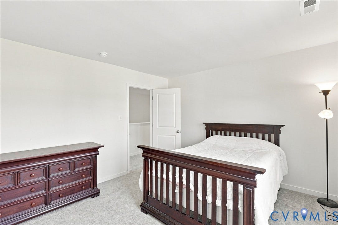 6400 Richwood Trail, Aston Oaks (Section 1), Chesterfield, VA 23120 Neutral wall color, light-toned carpet flooring, white interior door, and built-in closet shelving