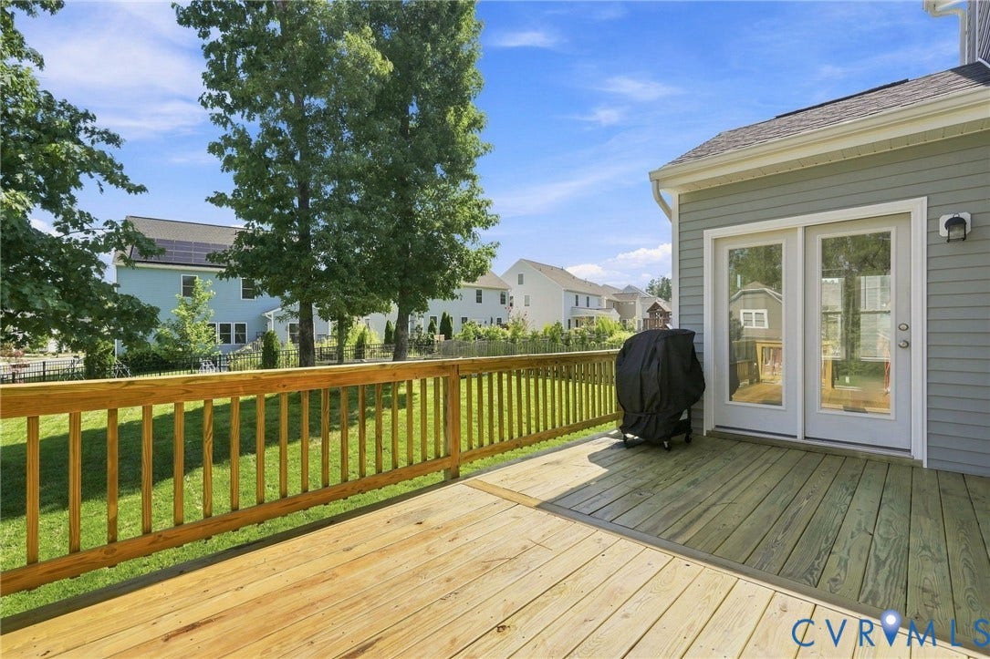 6400 Richwood Trail, Aston Oaks (Section 1), Chesterfield, VA 23120 Wood deck with a natural wood railing, double glass-paneled doors, and gray horizontal siding