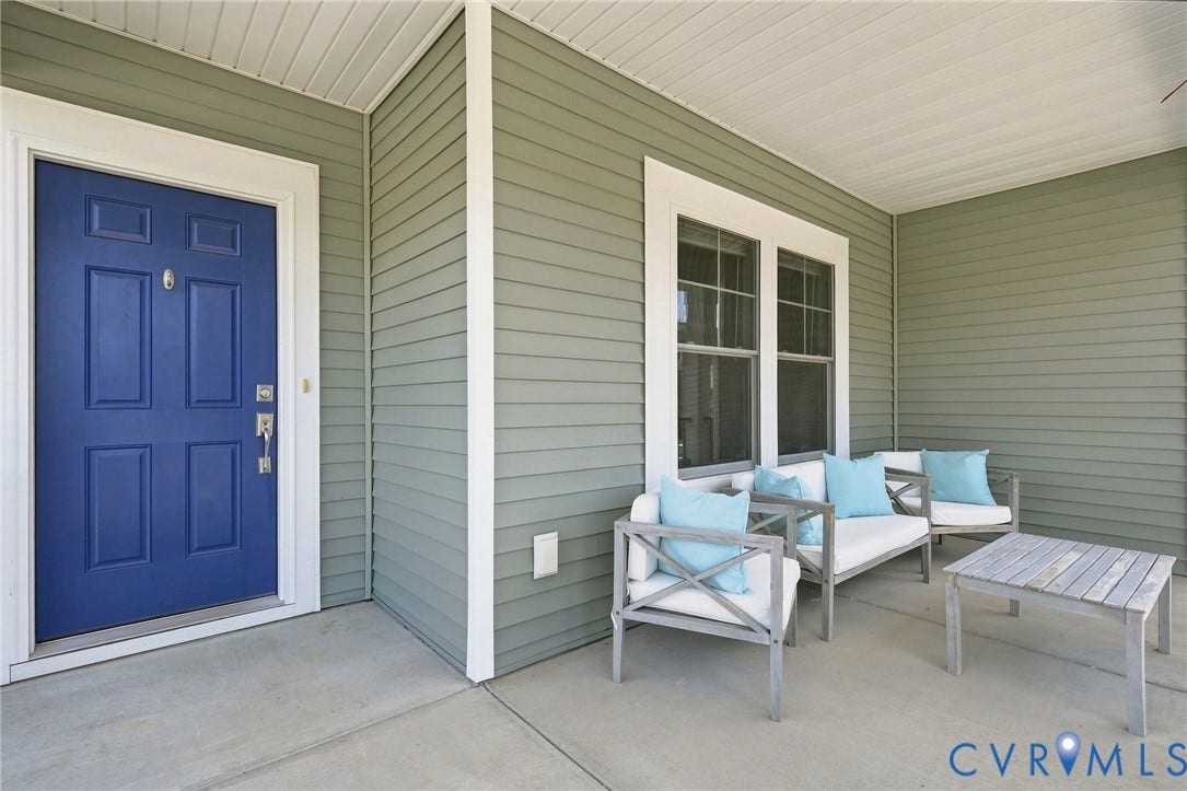 6400 Richwood Trail, Aston Oaks (Section 1), Chesterfield, VA 23120 Covered porch with concrete flooring, accented by horizontal siding and a paneled entry door