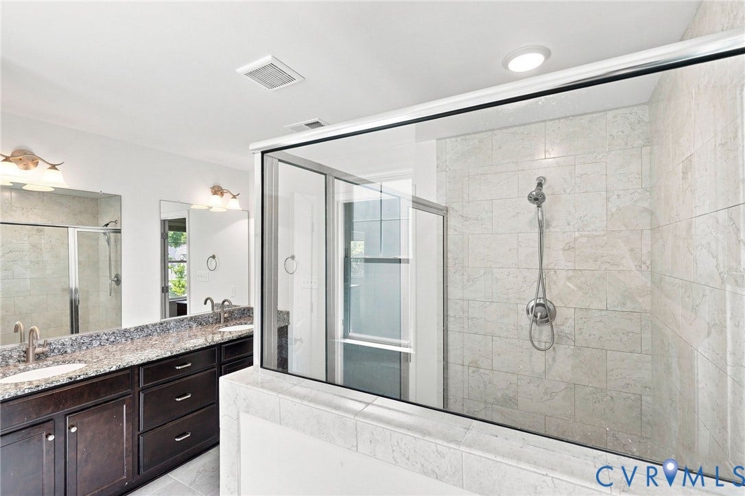 6400 Richwood Trail, Aston Oaks (Section 1), Chesterfield, VA 23120 Spacious bathroom featuring a glass-enclosed shower with subway tile, a dual vanity with a stone countertop, and dark wood-finish cabinetry