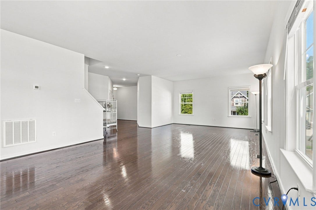 6400 Richwood Trail, Aston Oaks (Section 1), Chesterfield, VA 23120 Expansive room featuring wood-finish flooring, white walls, and multiple windows
