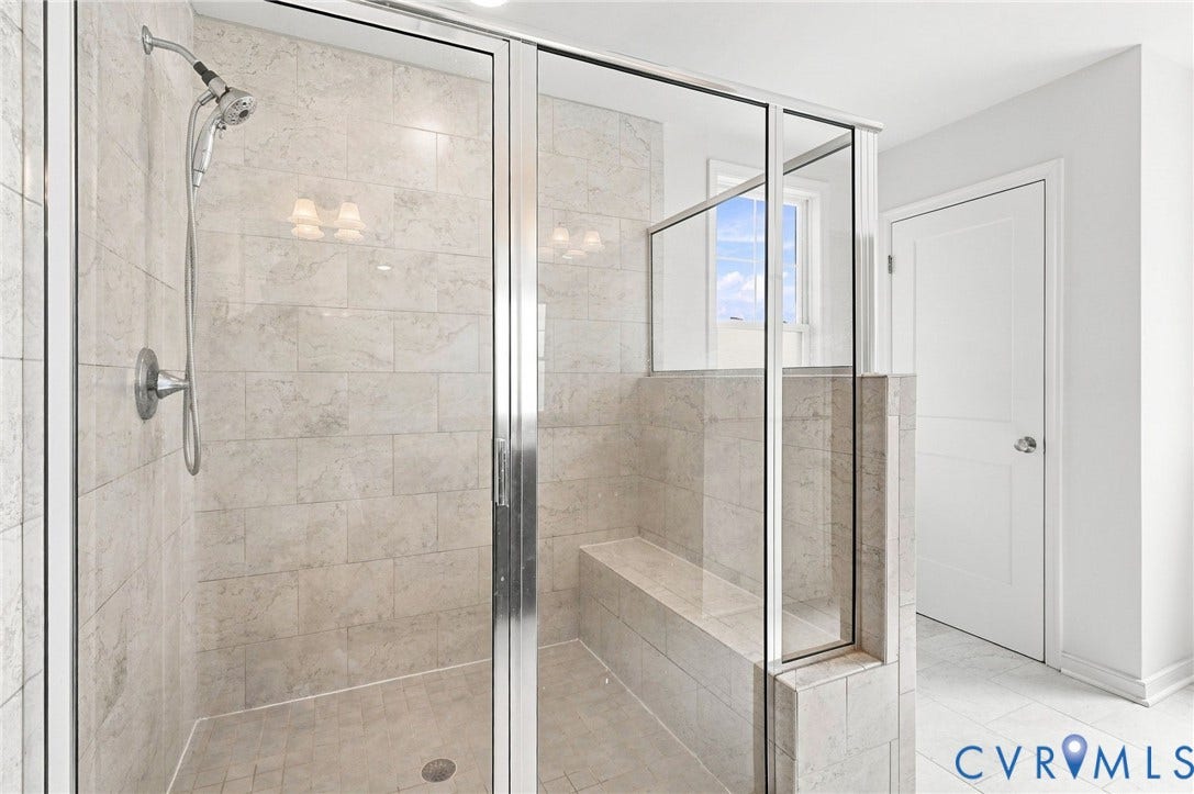 6400 Richwood Trail, Aston Oaks (Section 1), Chesterfield, VA 23120 Enclosed shower with clear glass panels, a built-in bench, and a handheld showerhead