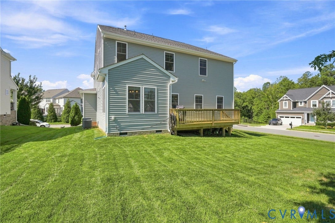 6400 Richwood Trail, Aston Oaks (Section 1), Chesterfield, VA 23120 Expansive green lawn, wood deck, light blue siding, white-trimmed windows, and a gabled roofline