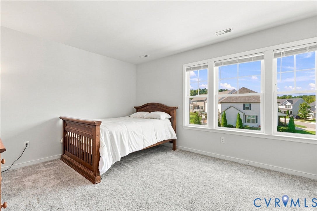 6400 Richwood Trail, Aston Oaks (Section 1), Chesterfield, VA 23120 Light-toned wall finishes, light-toned carpeting, and a series of three windows providing ample natural light
