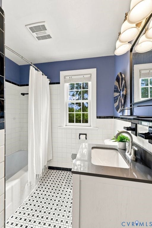 8709 Gayton Road, Henrico, VA 23229 full bath with updated vanity & fixtures complimented by original, classic tile