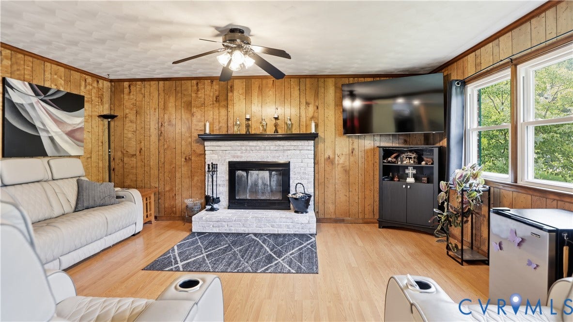 11201 Monday Way, Chesterfield, VA 23112 Wood-paneled walls and a ceiling fan with integrated lighting