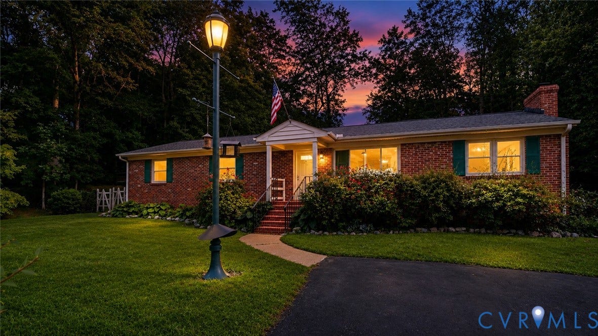 11201 Monday Way, Chesterfield, VA 23112 Brick exterior with a gabled entry, asphalt driveway, mature landscaping, and a prominent street lamp