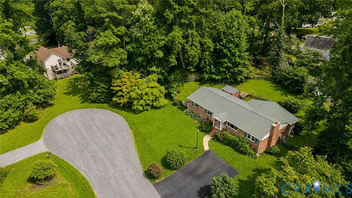 11201 Monday Way, Chesterfield, VA 23112 Extensive lot featuring a brick-sided residence with green shutters, a paved driveway, and a gravel cul-de-sac