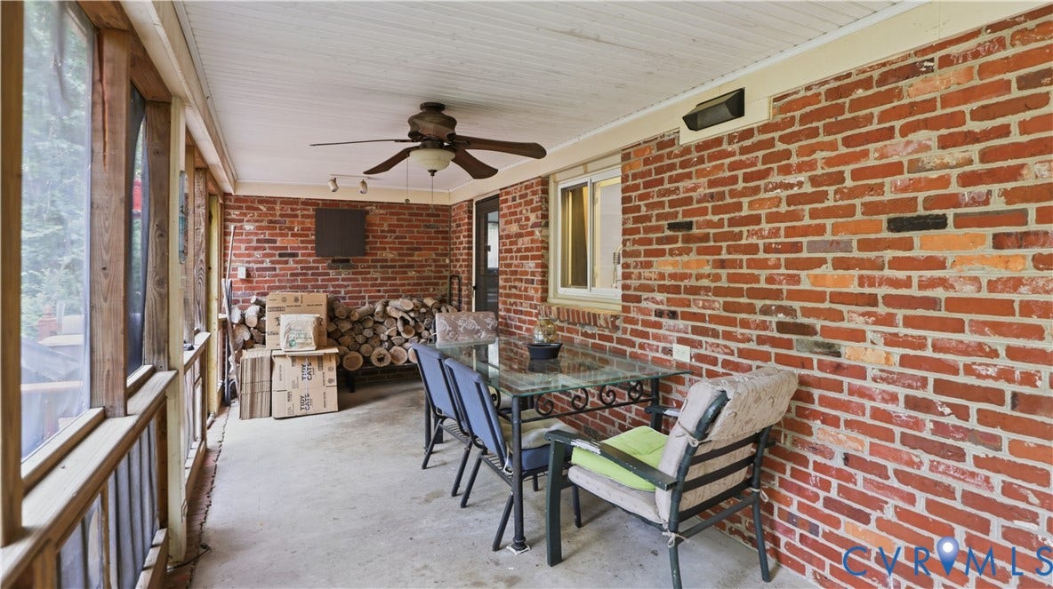 11201 Monday Way, Chesterfield, VA 23112 Screened-in porch featuring a brick wall, concrete flooring, wood-paneled ceiling, and a ceiling fan