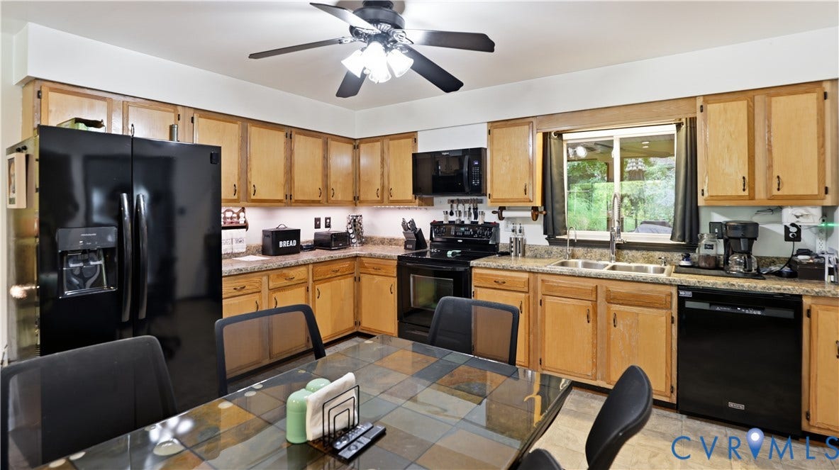 11201 Monday Way, Chesterfield, VA 23112 Kitchen featuring wood cabinetry, black appliances, a double basin stainless steel sink, and a ceiling fan with integrated lighting
