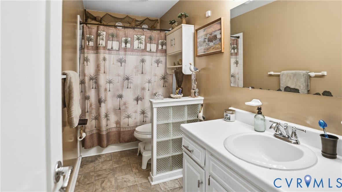 11201 Monday Way, Chesterfield, VA 23112 White vanity with integrated sink and chrome faucet