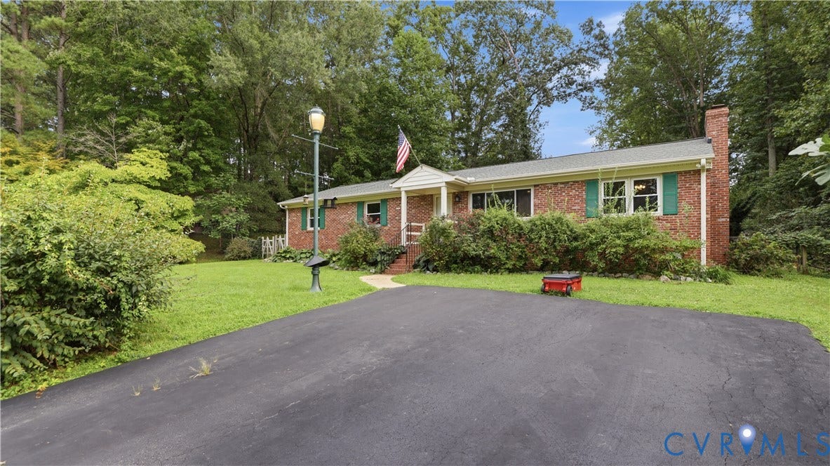 11201 Monday Way, Chesterfield, VA 23112 Brick exterior with a white portico and green shutters