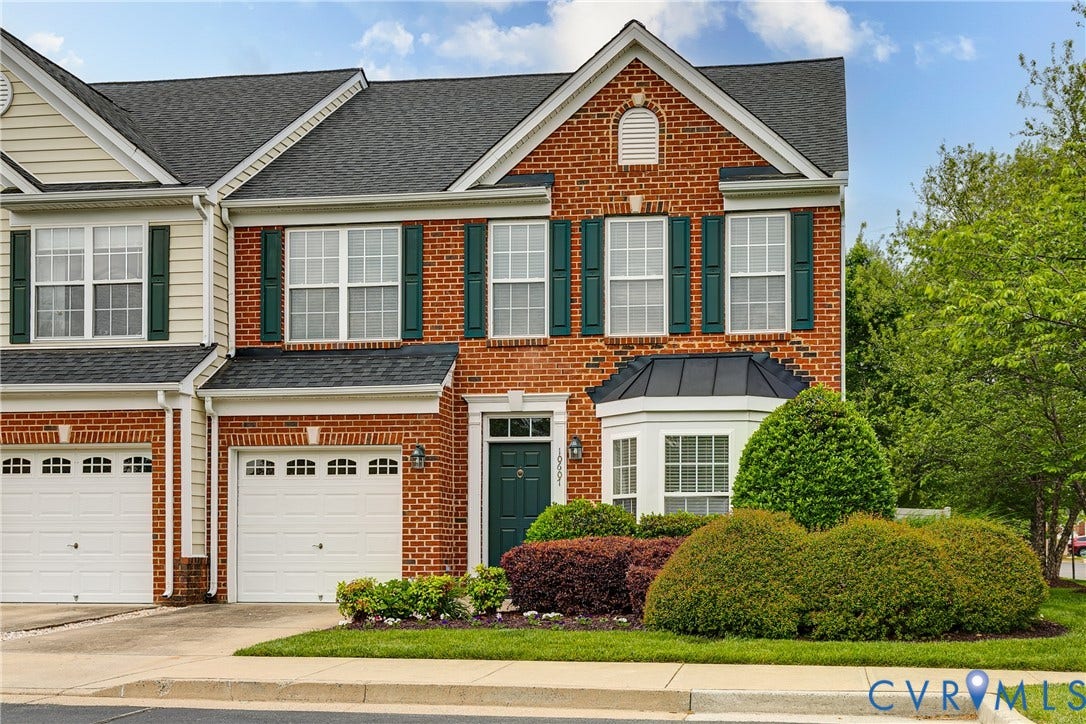 10607 Gate House Court, Glen Allen, VA 23059 Brick facade with a bay window, dark green shutters, and a covered front entry