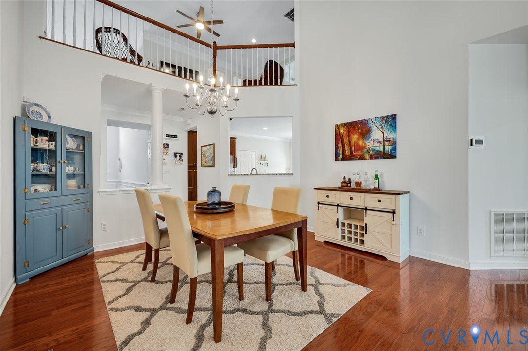 2811 Murano Way, The Villas At Hunton Park, Glen Allen, VA 23059 Hardwood flooring, soaring ceilings, open architectural pass-through, upper-level railing, and a chandelier lighting fixture