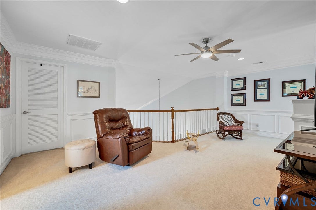 2811 Murano Way, The Villas At Hunton Park, Glen Allen, VA 23059 Spacious bonus room with soaring vaulted ceilings, ceiling fan with integrated lighting, and wide-plank wood-finish flooring throughout
