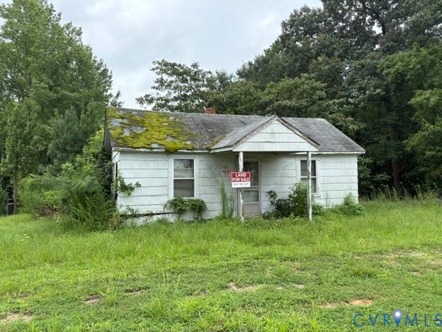 421 E Hundred Road, Chester/ Bermuda Area, Chester, VA 23836 Existing structure with a gabled roof and exterior siding, set on a grassy lot surrounded by mature trees