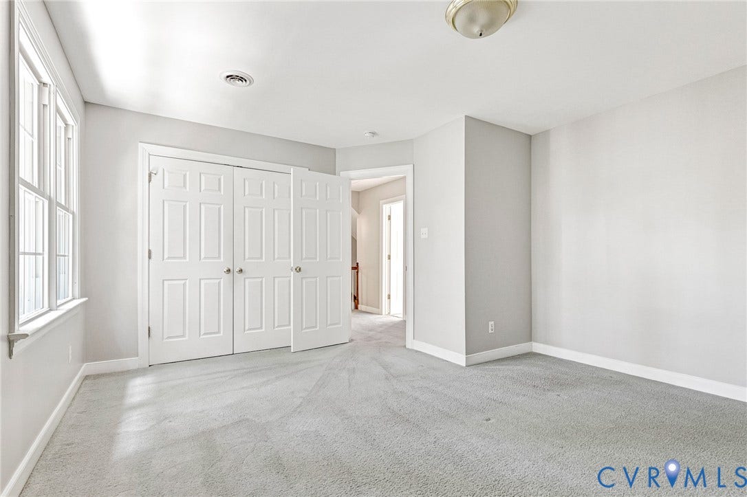 16406 Inchcape Road, Chesterfield, VA 23120 Light gray carpeting, white trim, white six-panel bi-fold closet doors, and a window with white sills and framing