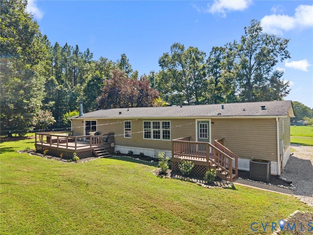 4554 Powhatan Lakes Road, Powhatan, VA 23139 Charming manufactured home set on expansive manicured grounds with mature tree-lined backdrop