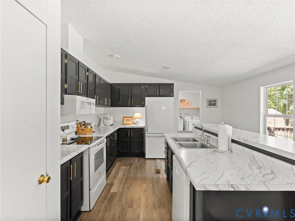 4554 Powhatan Lakes Road, Powhatan, VA 23139 Kitchen featuring black cabinetry, white countertops, wood-finish flooring, and white appliances