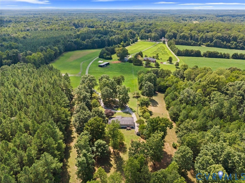 4554 Powhatan Lakes Road, Powhatan, VA 23139 Sprawling rural estate set on substantial acreage with mature hardwood and evergreen tree coverage