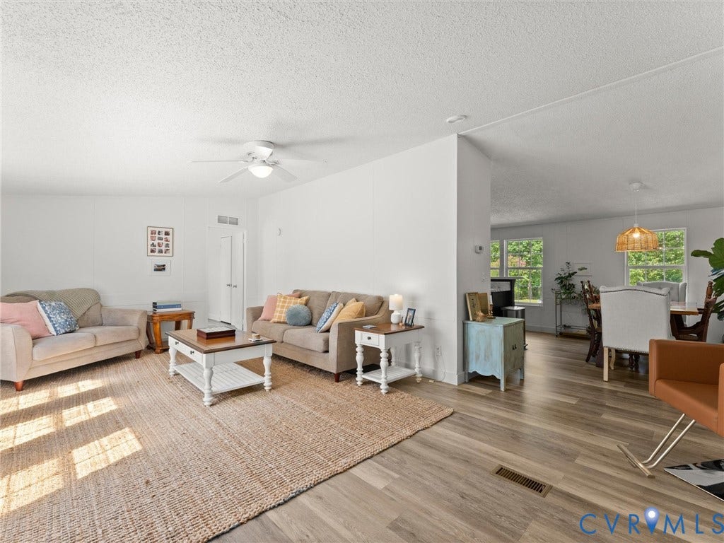 4554 Powhatan Lakes Road, Powhatan, VA 23139 Bright interior with wood-finish flooring and white walls
