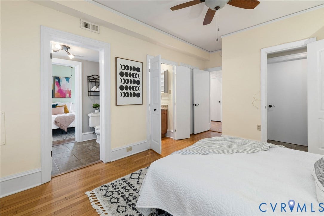 Hardwood flooring, SEPARATE DEDICATED VANITY, ceiling fan, and white trim work