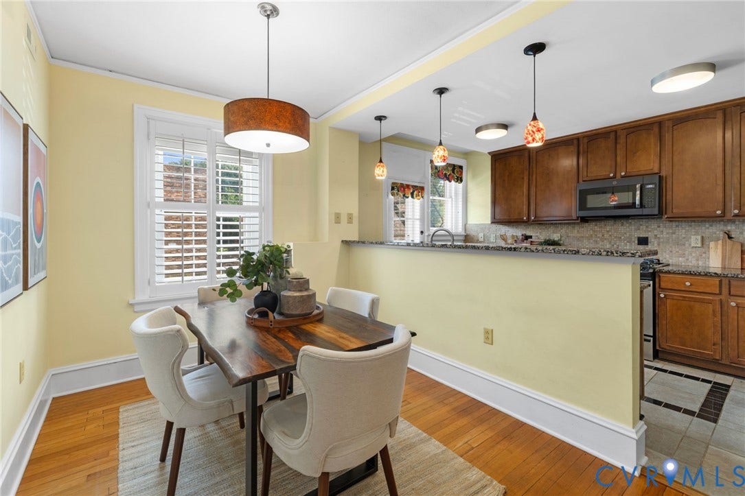Hardwood flooring, plantation shutters, recessed lighting, and a kitchen featuring wood cabinetry and a tile backsplash