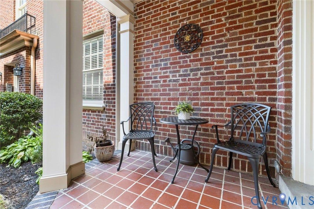 Brick exterior with white column accents